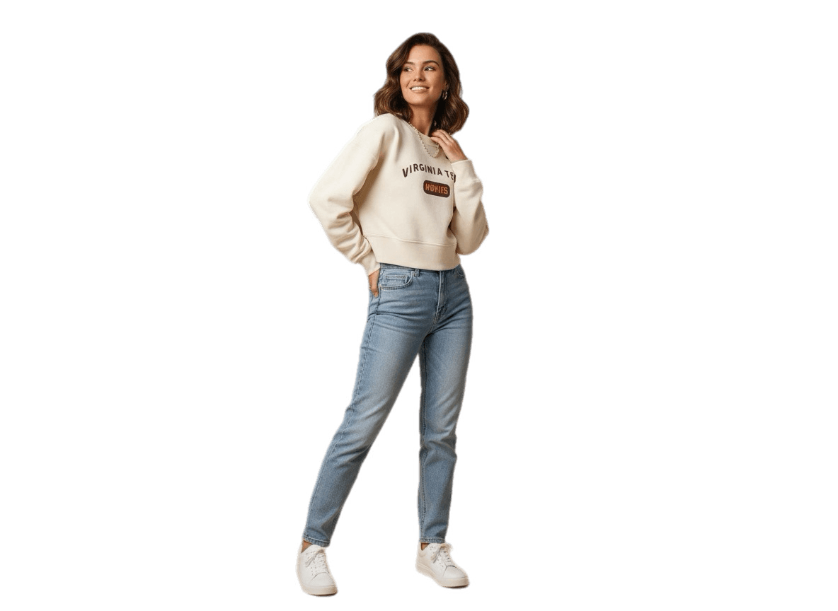 Nike women’s cream cropped hoodie with red embroidered logo on front, styled with light wash denim jeans and white sneakers, casual streetwear outfit